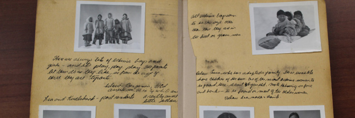 Old photos and handwritten descriptions displayed in an album.