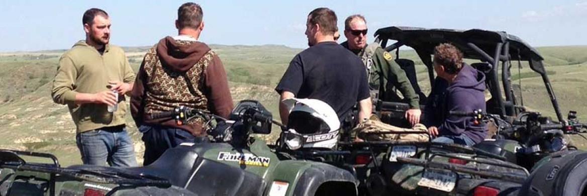 RCMP members on ATVs.