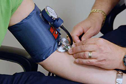 Close-up of an arm getting blood pressure taken
